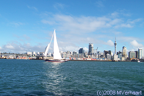 A photo of the Auckland city skyline, taken from the water.